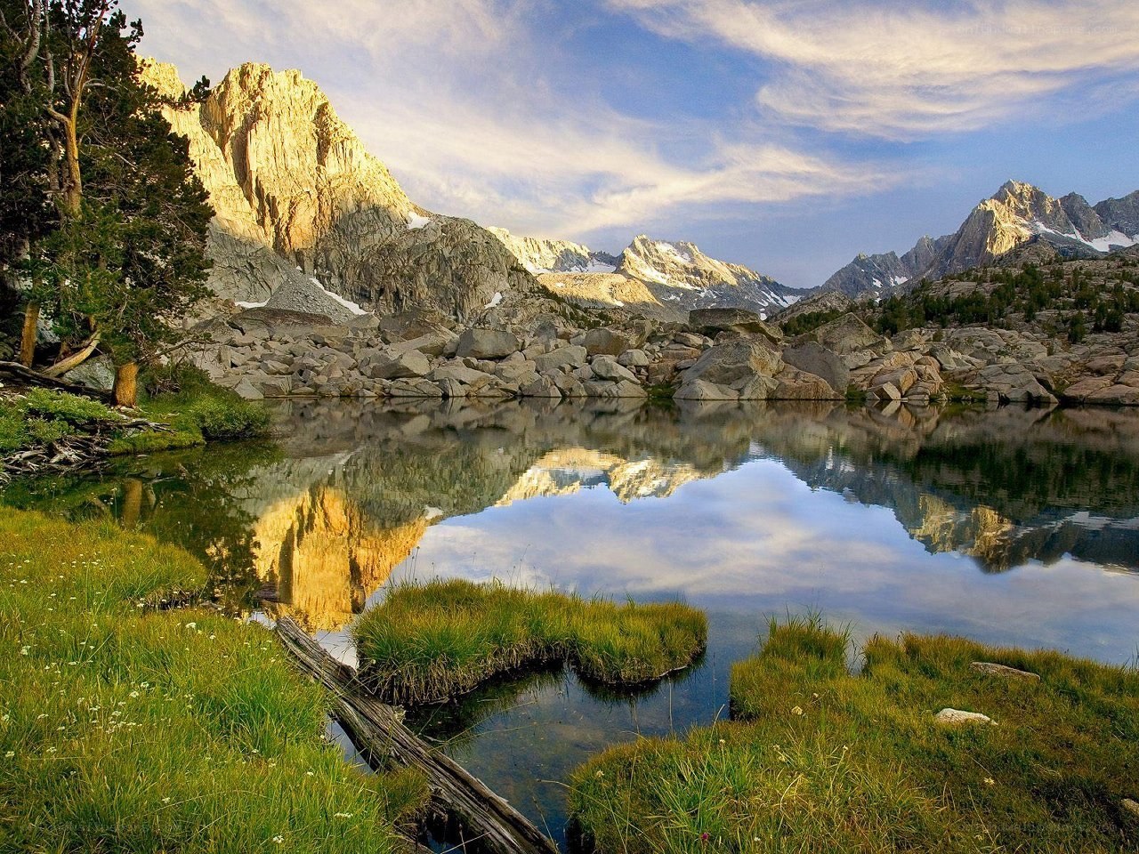 Mountain lake reflection at sunrise