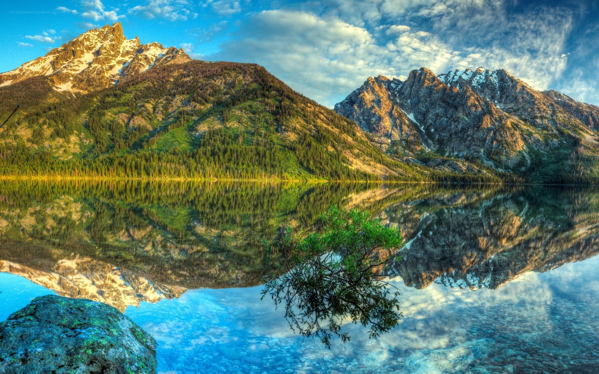 Mountain lake reflection at sunrise