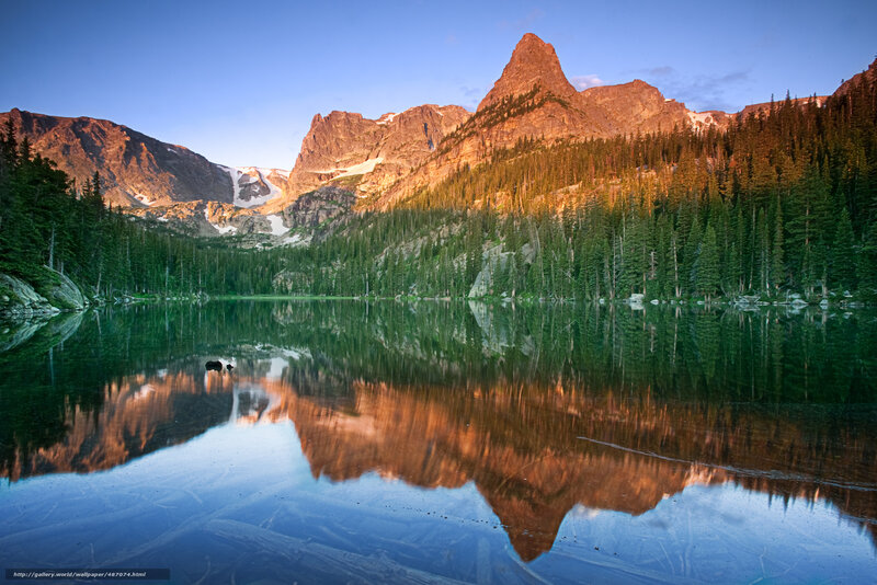 Mountain lake reflection at sunrise