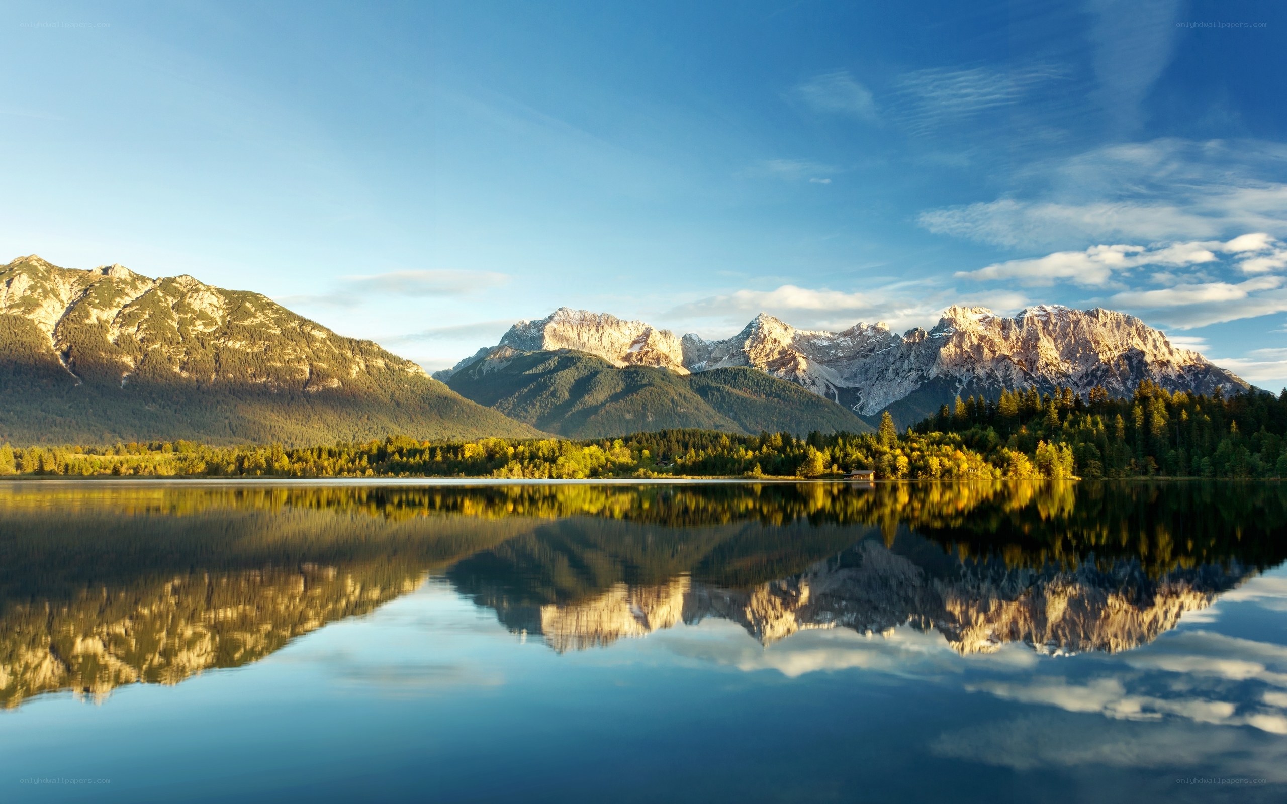 Mountain lake reflection at sunrise
