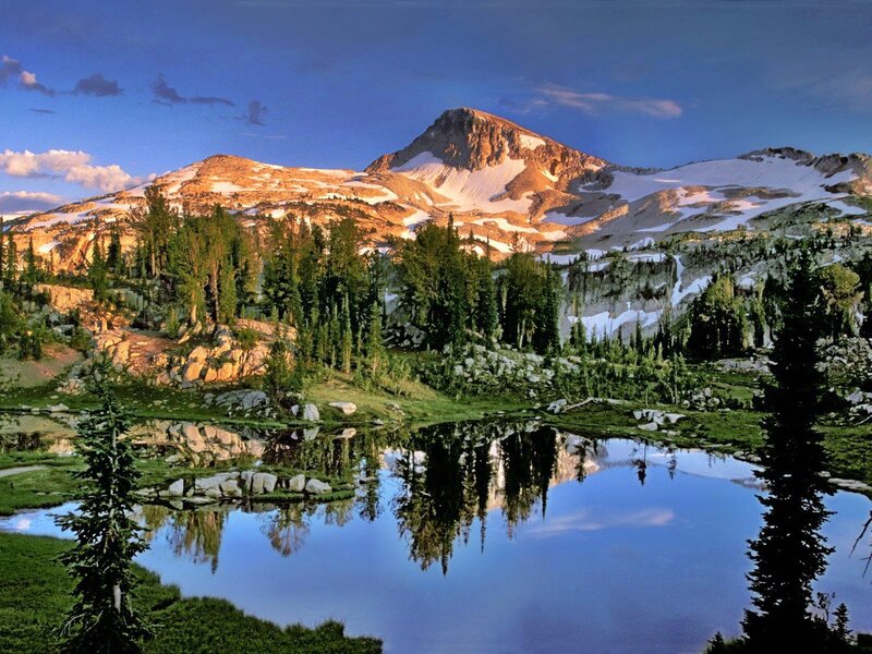 Mountain lake reflection at sunset