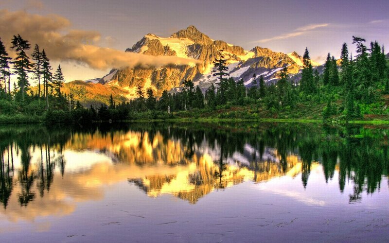 Mountain lake reflection at sunset