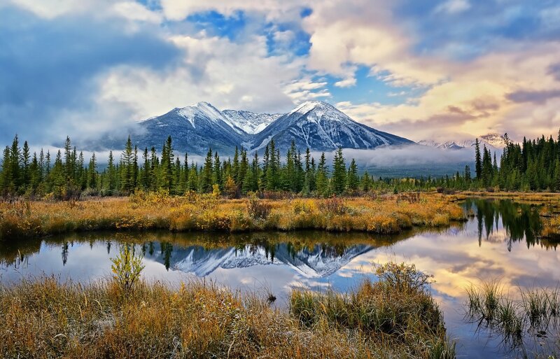 Mountain lake reflection at sunset