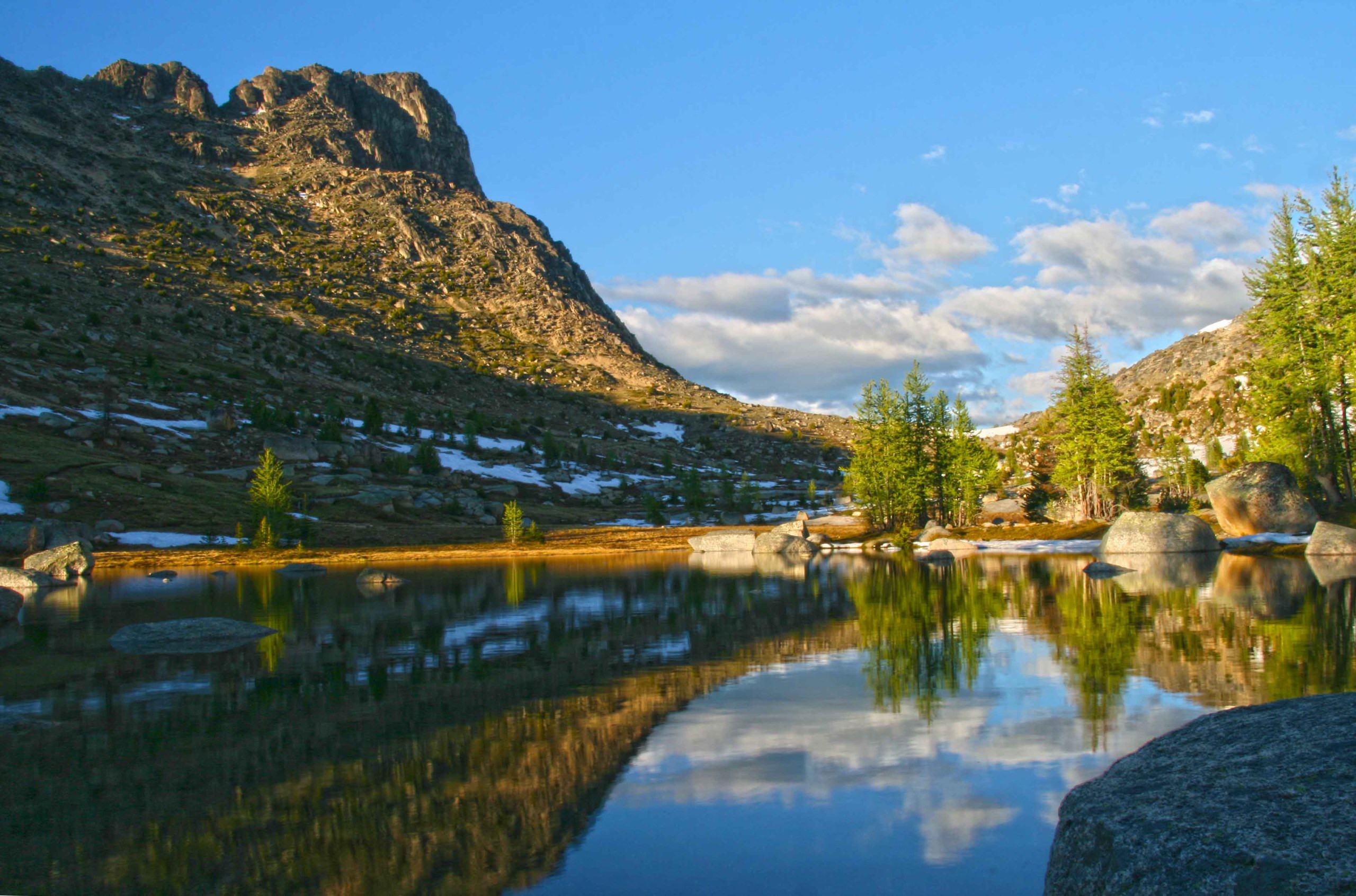 Mountain lake reflection at sunset