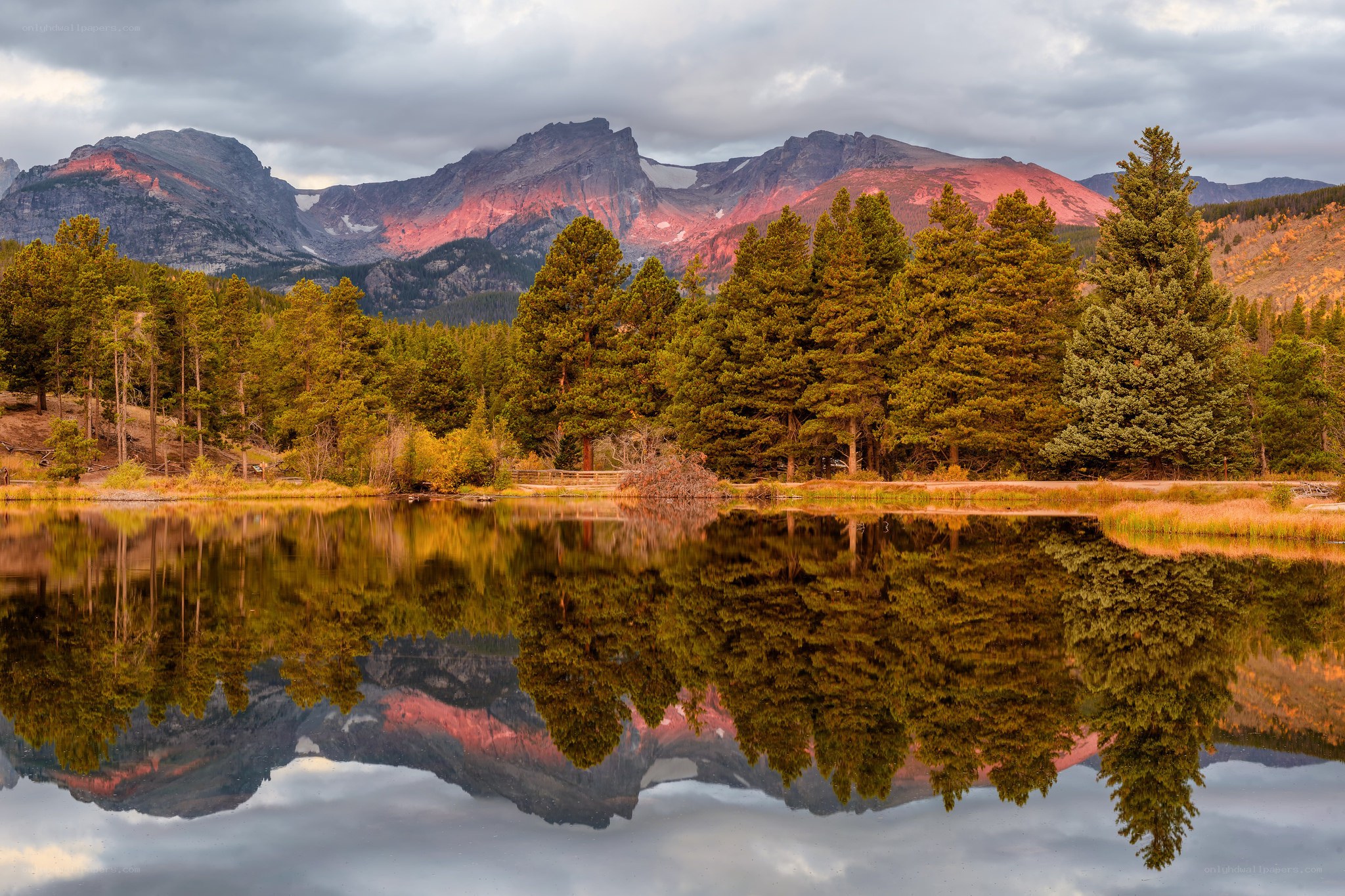 Mountain lake reflection at sunset