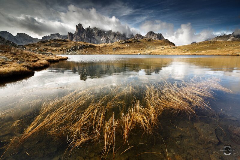 Mountain Lake Reflection — Blue, Dramatic, Afternoon, Photograph, Mountains, Clouds, Grass