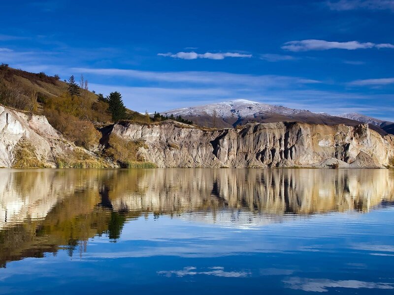 Mountain Lake Reflection — Blue, Serene, Afternoon, Photograph, Mountains, Cliffs, Trees, White