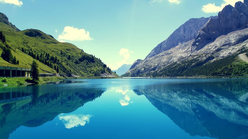 Mountain Lake Reflection — Blue, Serene, Afternoon, Photograph, Mountains, Clouds, Bridge