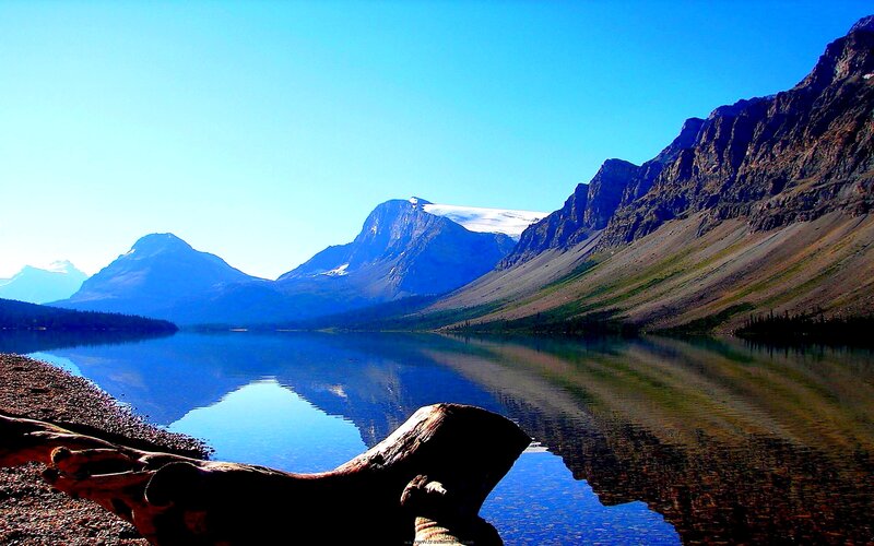 Mountain Lake Reflection — Blue, Serene, Afternoon, Photograph, Mountains, Driftwood