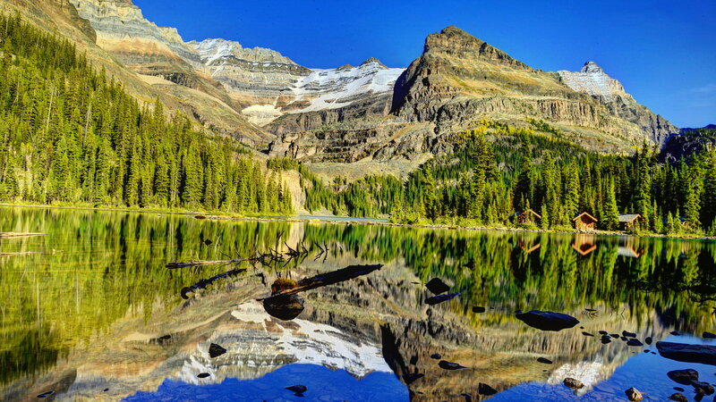 Mountain Lake Reflection — Blue, Serene, Afternoon, Photograph, Mountains, Forest, Cabin