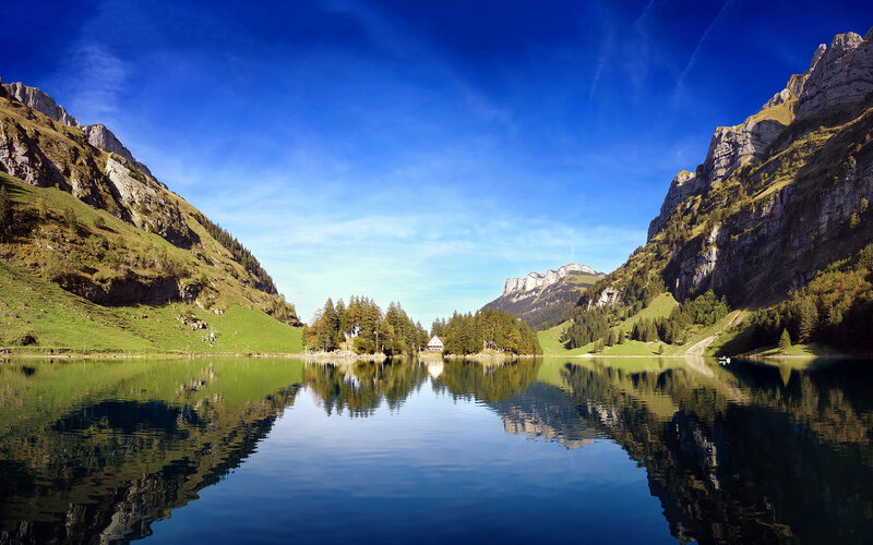 Mountain Lake Reflection — Blue, Serene, Afternoon, Photograph, Mountains, Trees, House