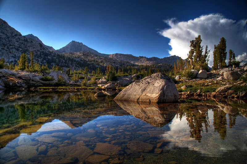 Mountain Lake Reflection — Blue, Serene, Afternoon, Photograph, Mountains, Trees, Rocks, Clouds, Green