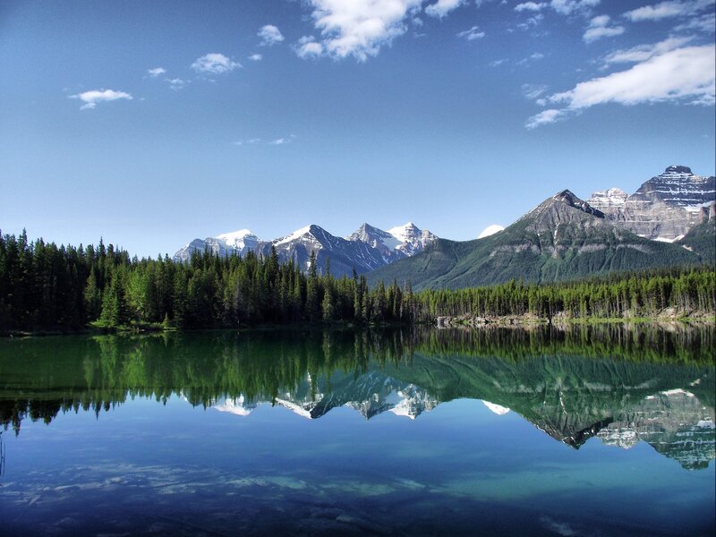 Mountain Lake Reflection — Blue, Serene, Afternoon, Photograph, Trees, Snow-capped Mountains, Sky