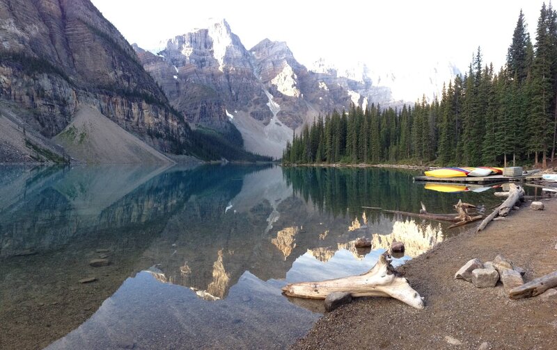 Mountain Lake Reflection — Blue, Serene, Morning, Photograph, Mountains, Trees, Canoes