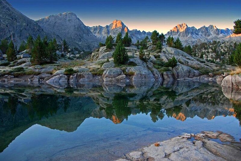 Mountain Lake Reflection — Blue, Serene, Sunrise, Photograph, Mountains, Trees, Rocks