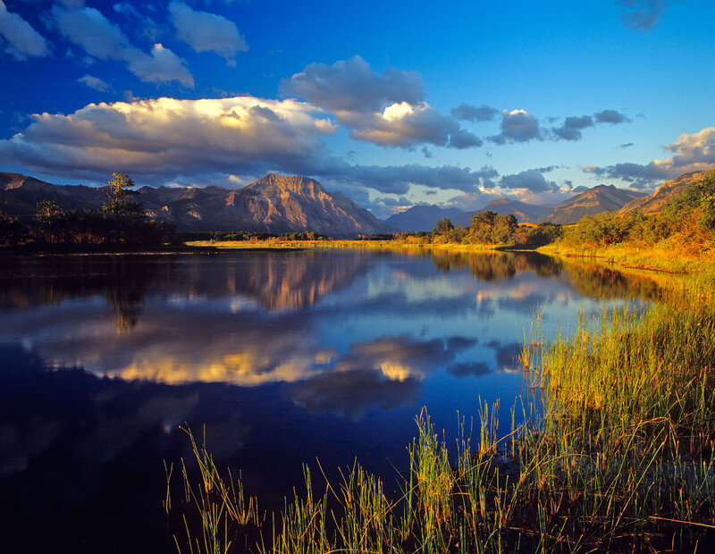 Mountain Lake Reflection — Blue, Serene, Sunset, Photograph, Mountains, Clouds, Grass
