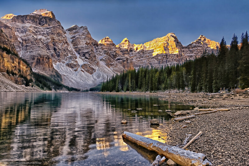 Mountain Lake Reflection — Blue, Serene, Sunset, Photograph, Snow-capped Mountains, Evergreen Trees, Pebble Shore