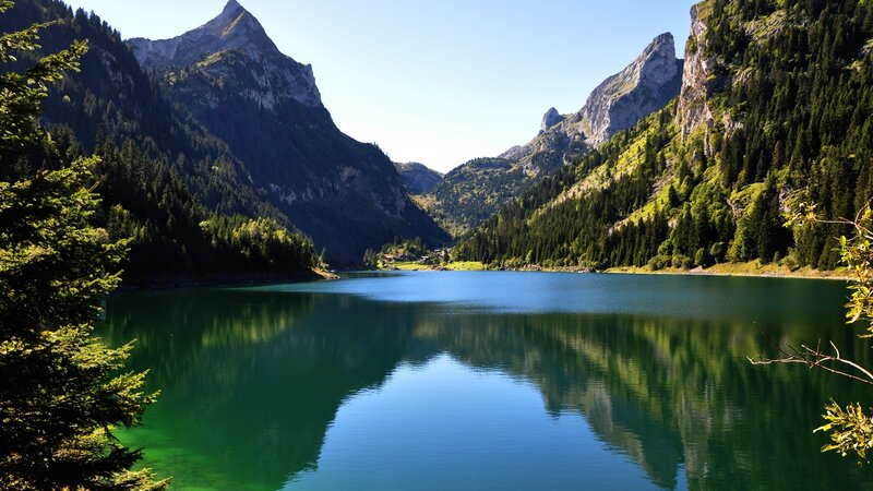 Mountain Lake Reflection — Green, Serene, Afternoon, Photograph, Trees, Mountains, Village