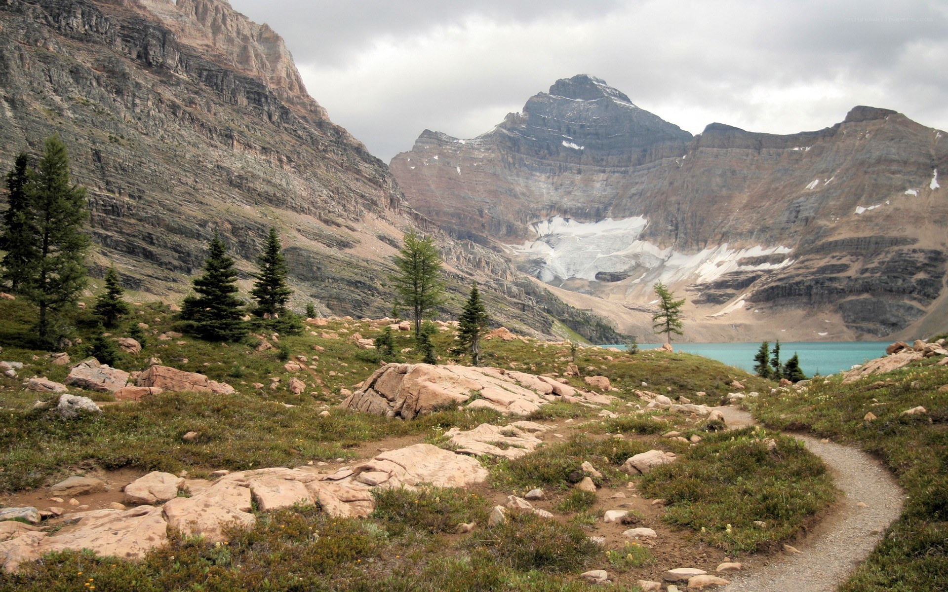 Mountain lake trail with glacier