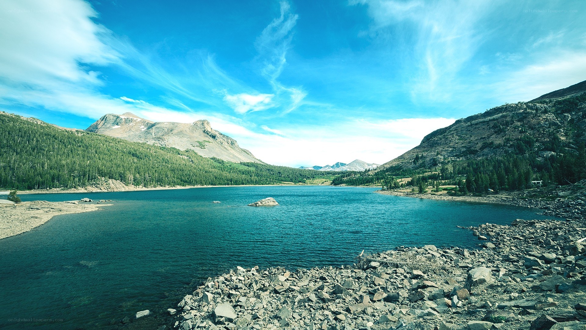 Mountain lake under blue sky