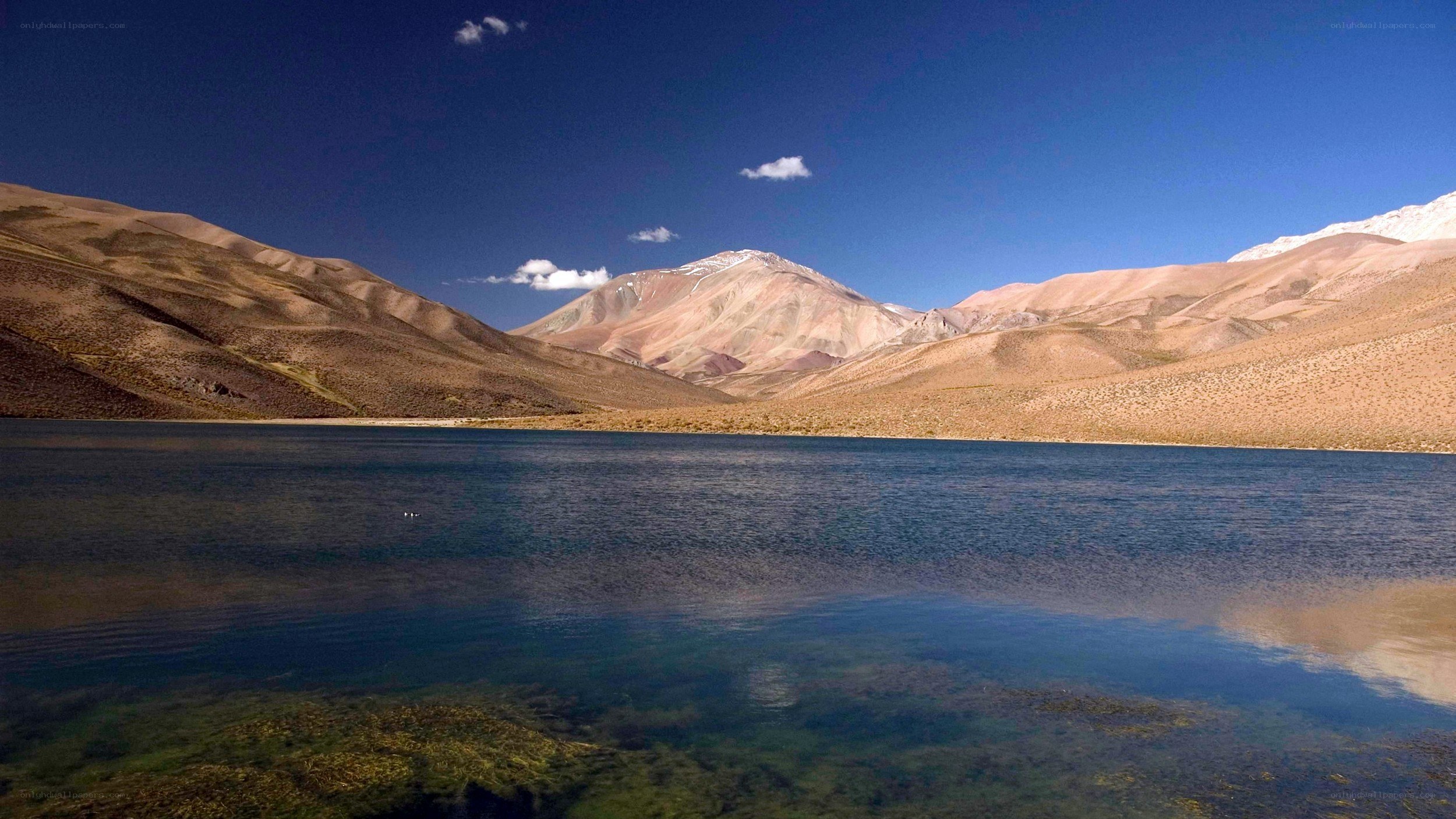 Mountain lake under blue sky
