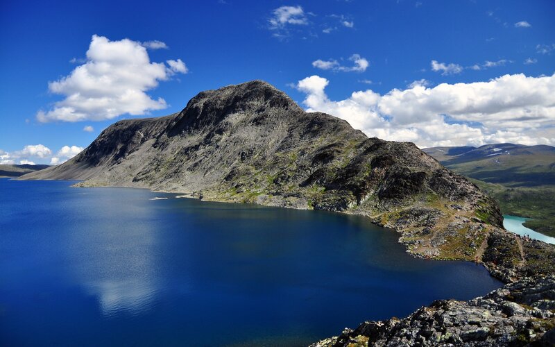 Mountain lake under blue sky