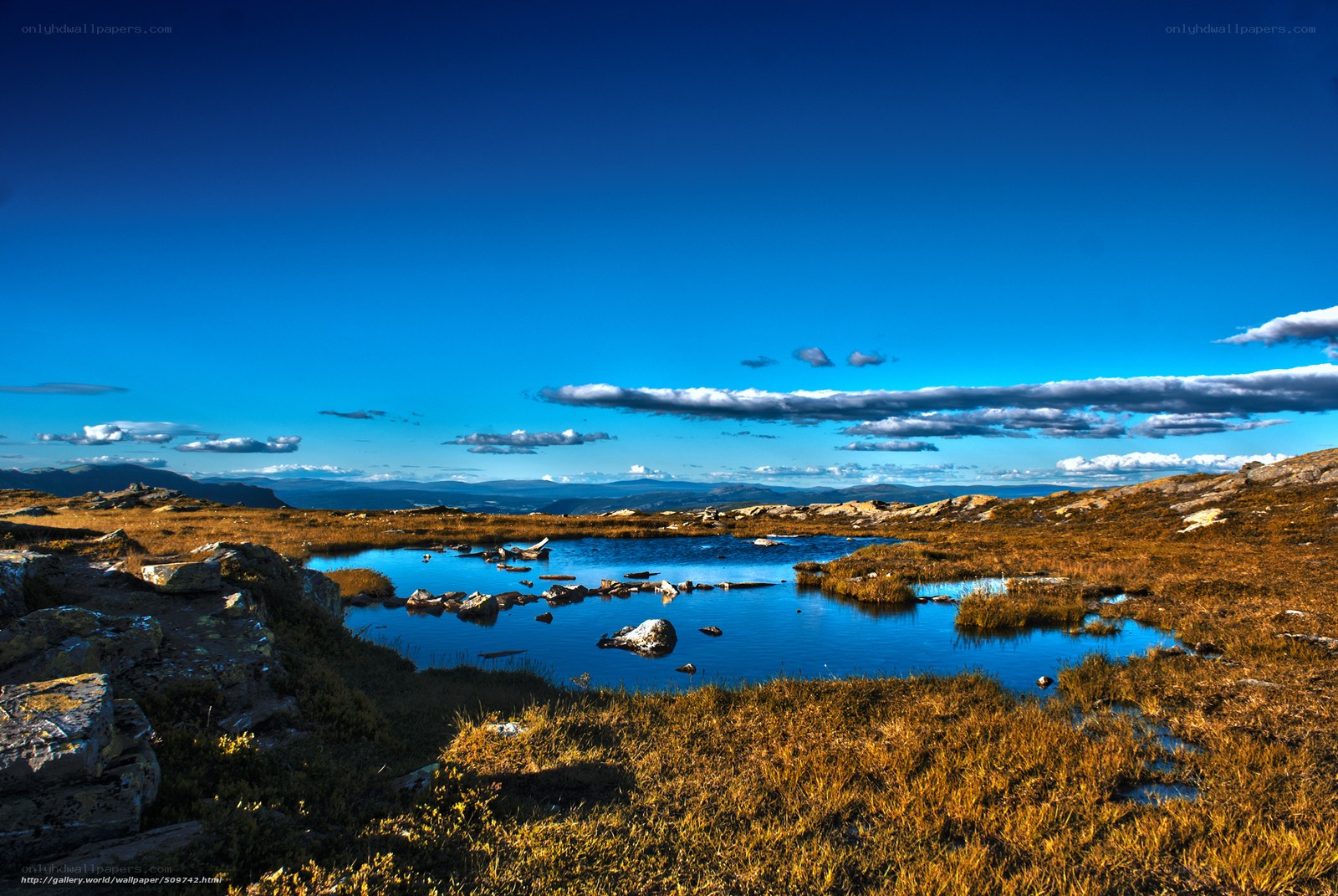 Mountain lake under blue sky