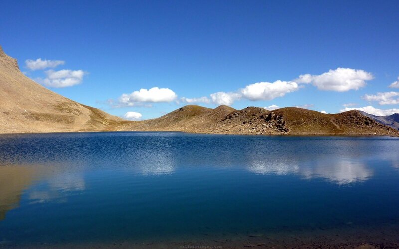 Mountain lake under blue sky