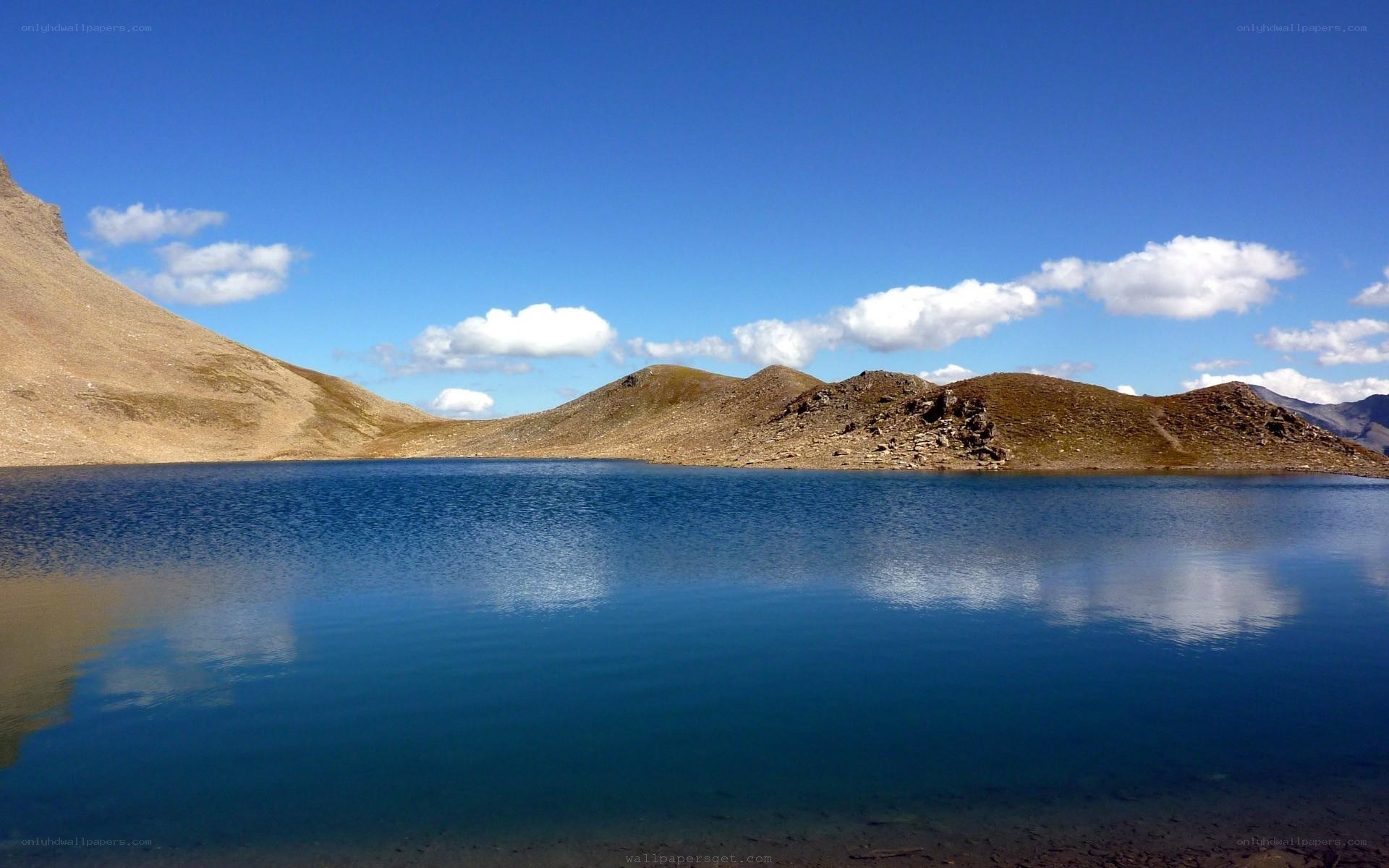 Mountain lake under blue sky