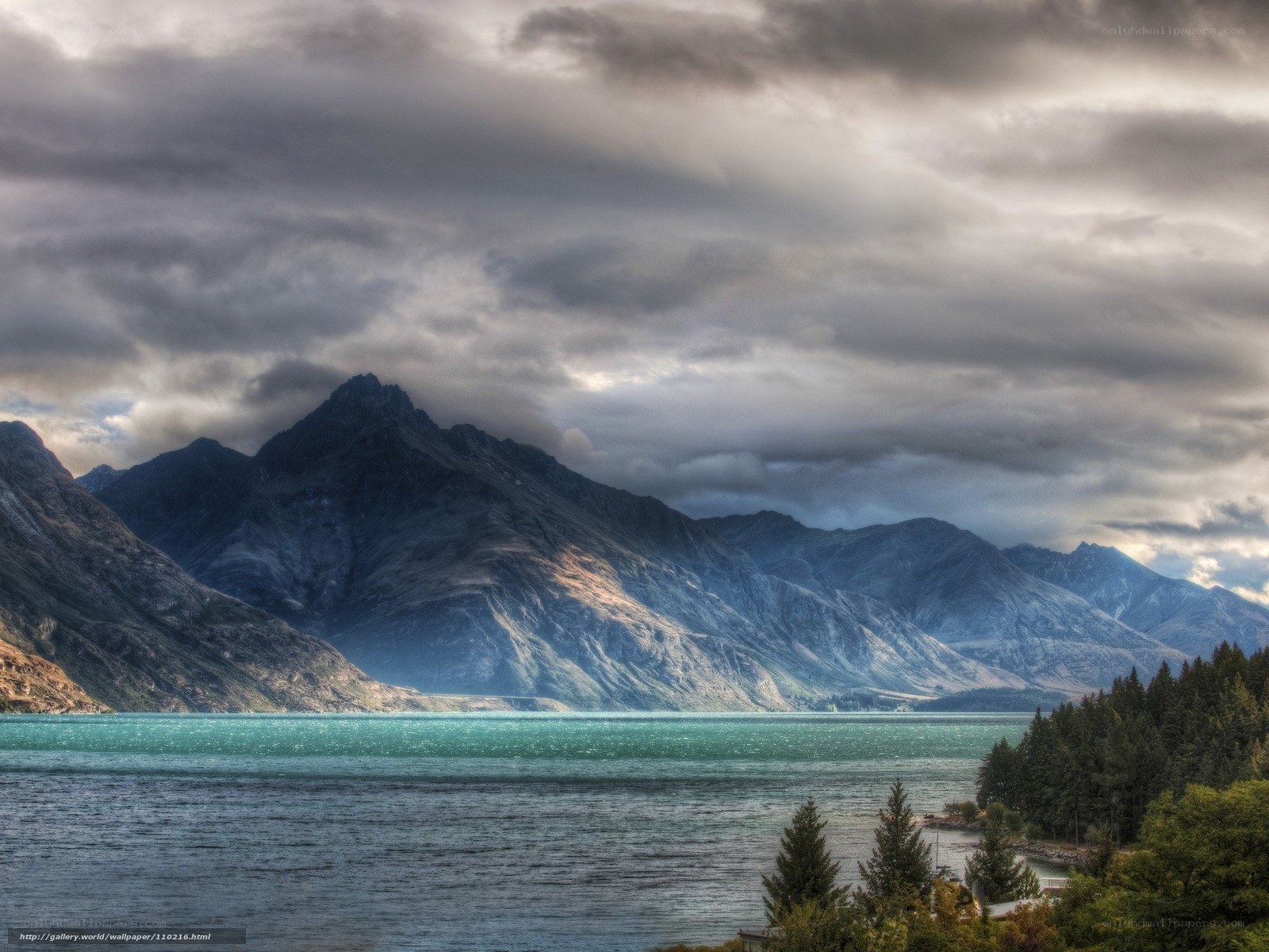 Mountain lake under cloudy sky