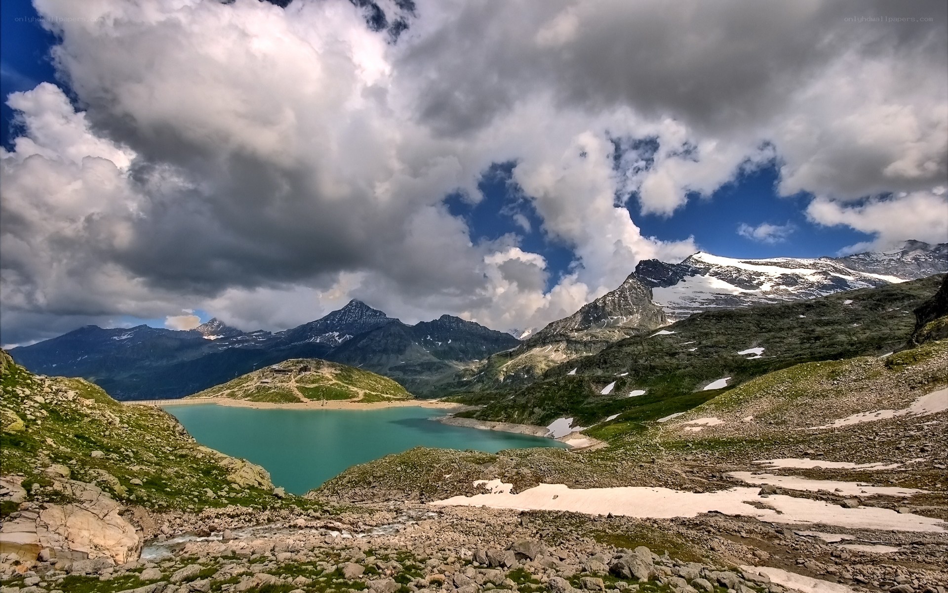 Mountain lake under cloudy sky