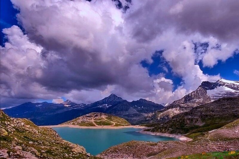 Mountain lake under cloudy sky