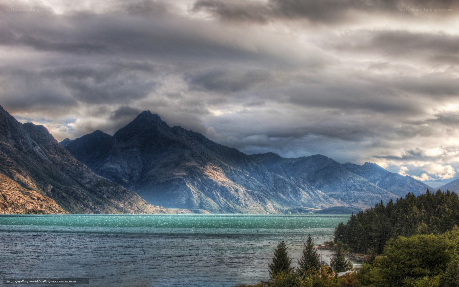 Mountain lake under cloudy sky