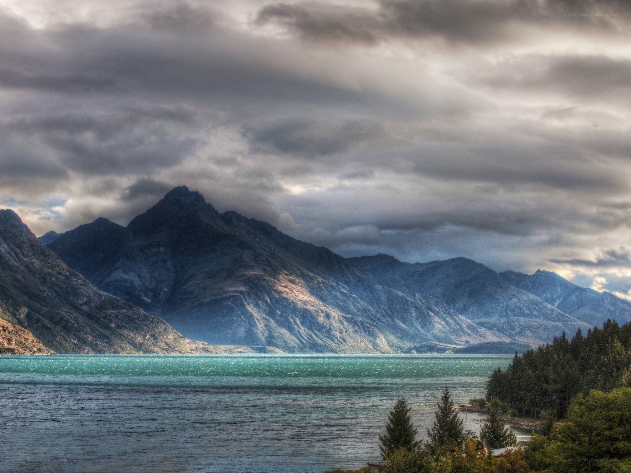 Mountain lake under cloudy sky