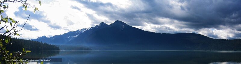Mountain lake under cloudy sky