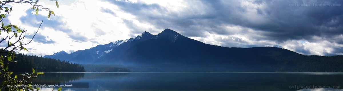 Mountain lake under cloudy sky