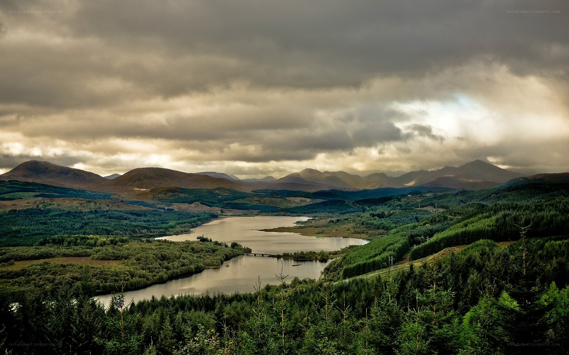 Mountain lake under cloudy sky
