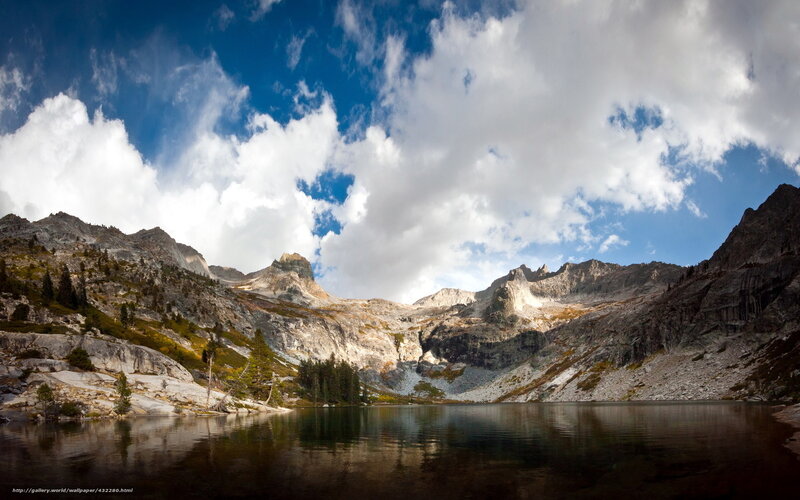 Mountain lake under cloudy sky