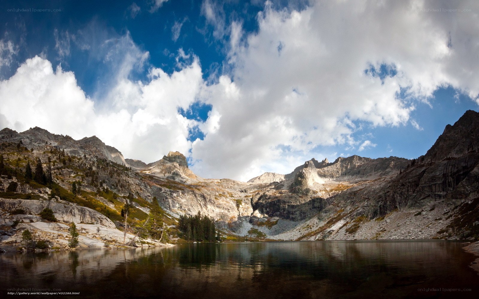 Mountain lake under cloudy sky
