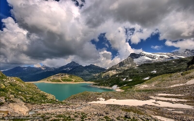 Mountain lake under cloudy sky
