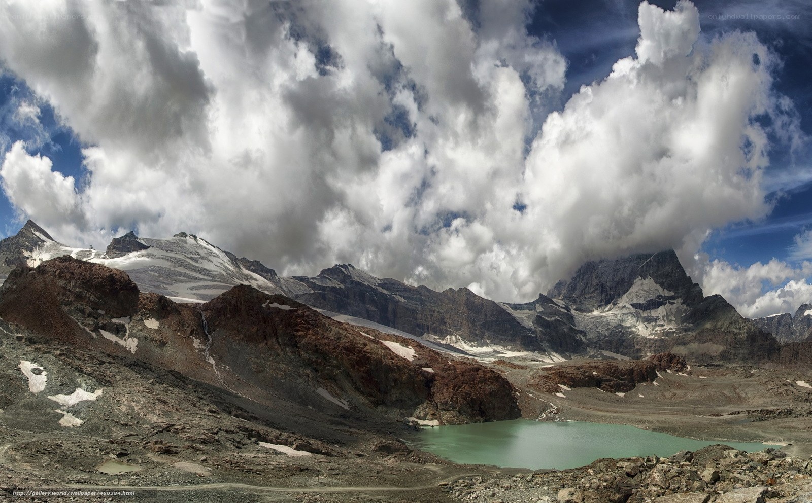 Mountain lake under cloudy sky