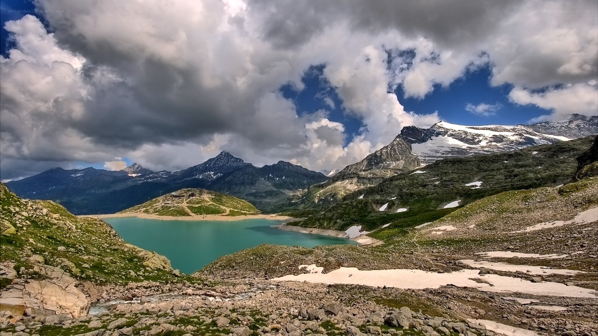Mountain lake under cloudy sky