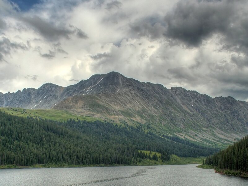 Mountain lake under cloudy sky