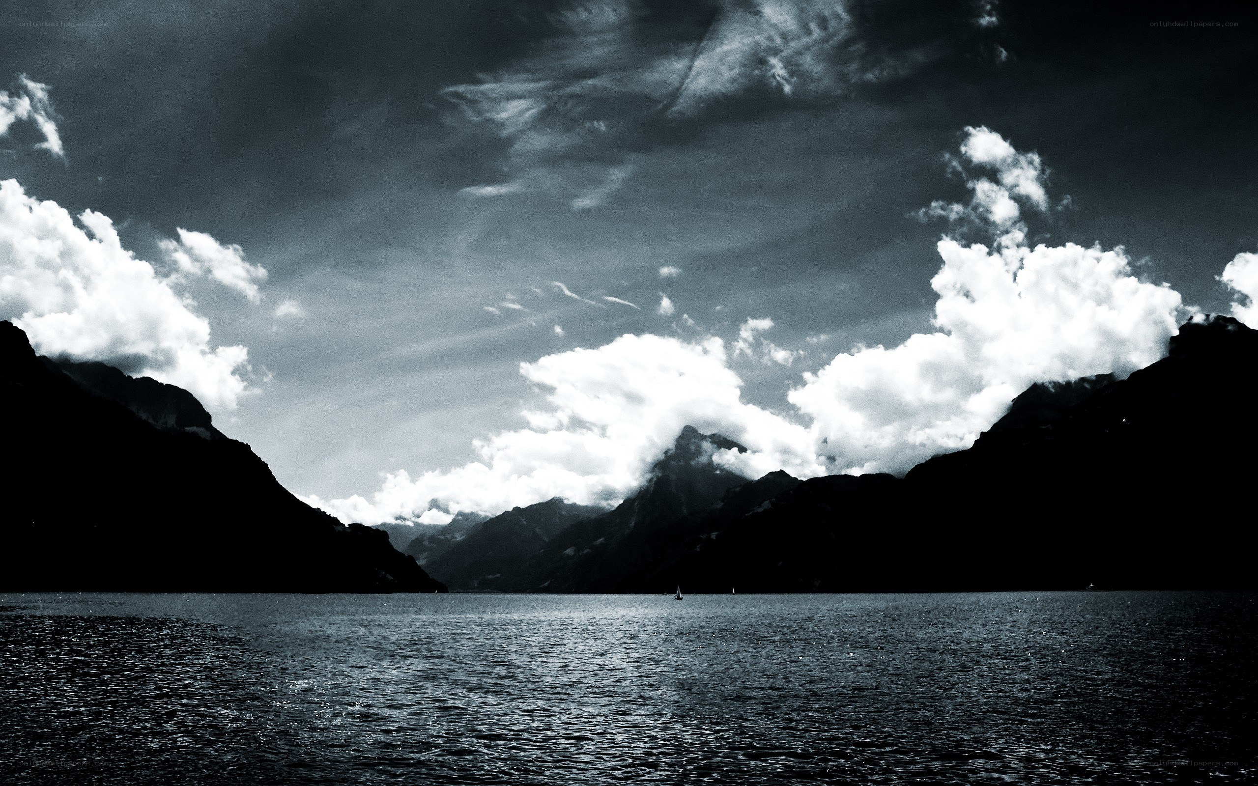 Mountain lake under cloudy sky