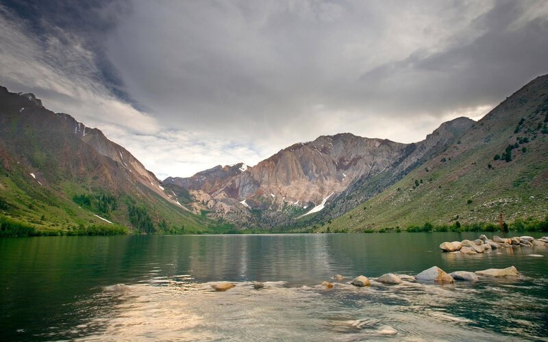 Mountain lake under cloudy sky