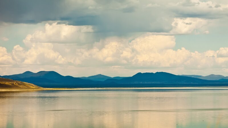 Mountain lake under cloudy sky