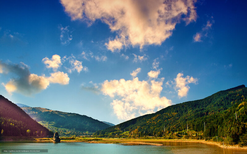 Mountain lake under cloudy sky
