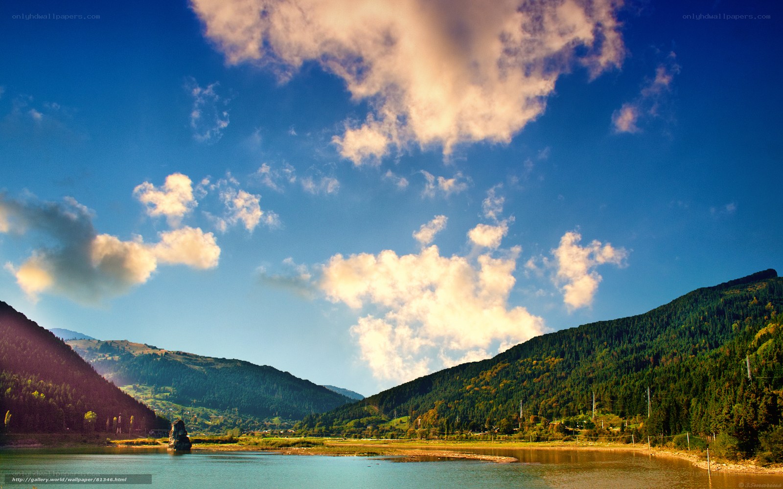 Mountain lake under cloudy sky