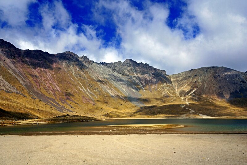 Mountain lake under cloudy sky