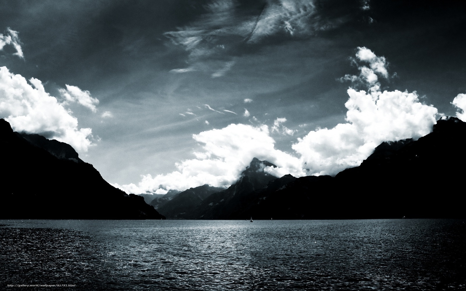Mountain lake under cloudy sky